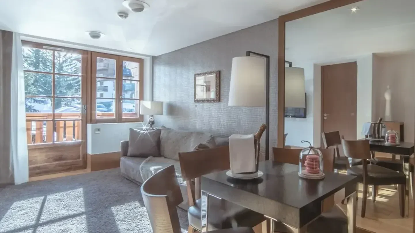 Cozy dining area at Baumanière 1850 in Courchevel, a charming mountain restaurant