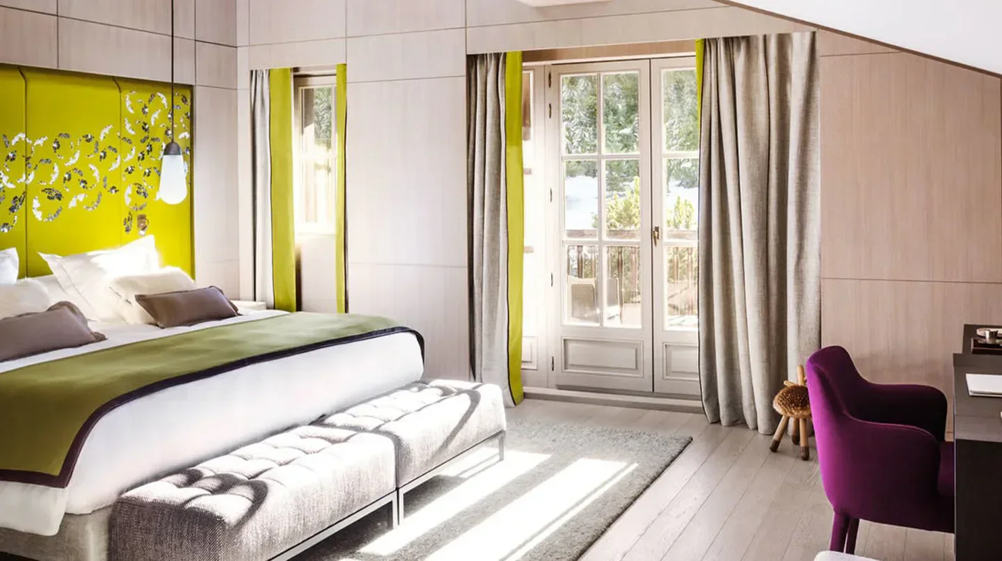 Cheval Blanc Courchevel bedroom with modern design and balcony in Courchevel.