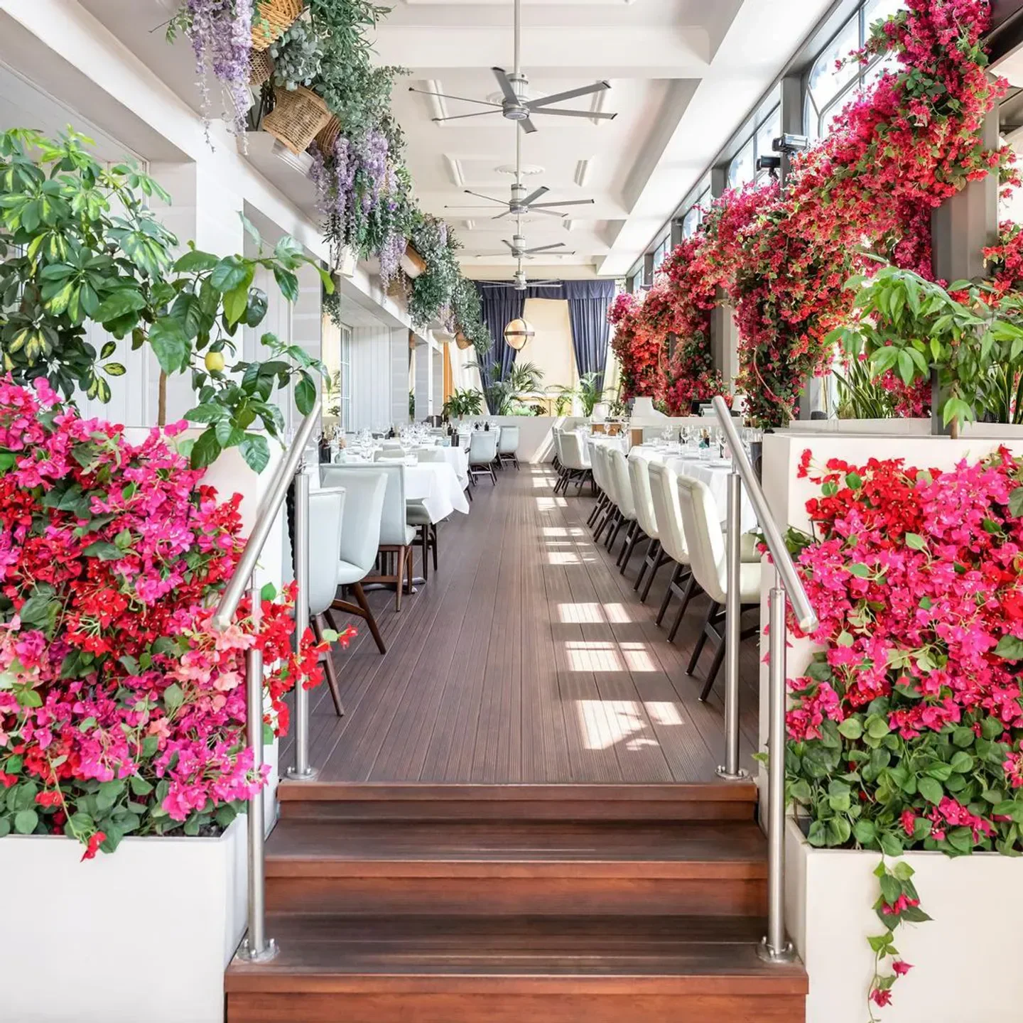 Interior of Gaia restaurant in Courchevel with floral decor and elegant seating