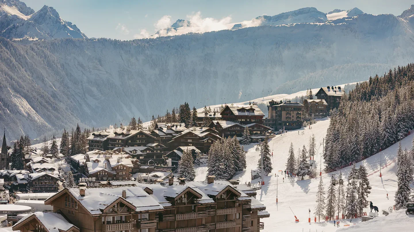 Hôtel Barrière Les Neiges in Courchevel, stunning winter resort town with snowy mountain backdrop.