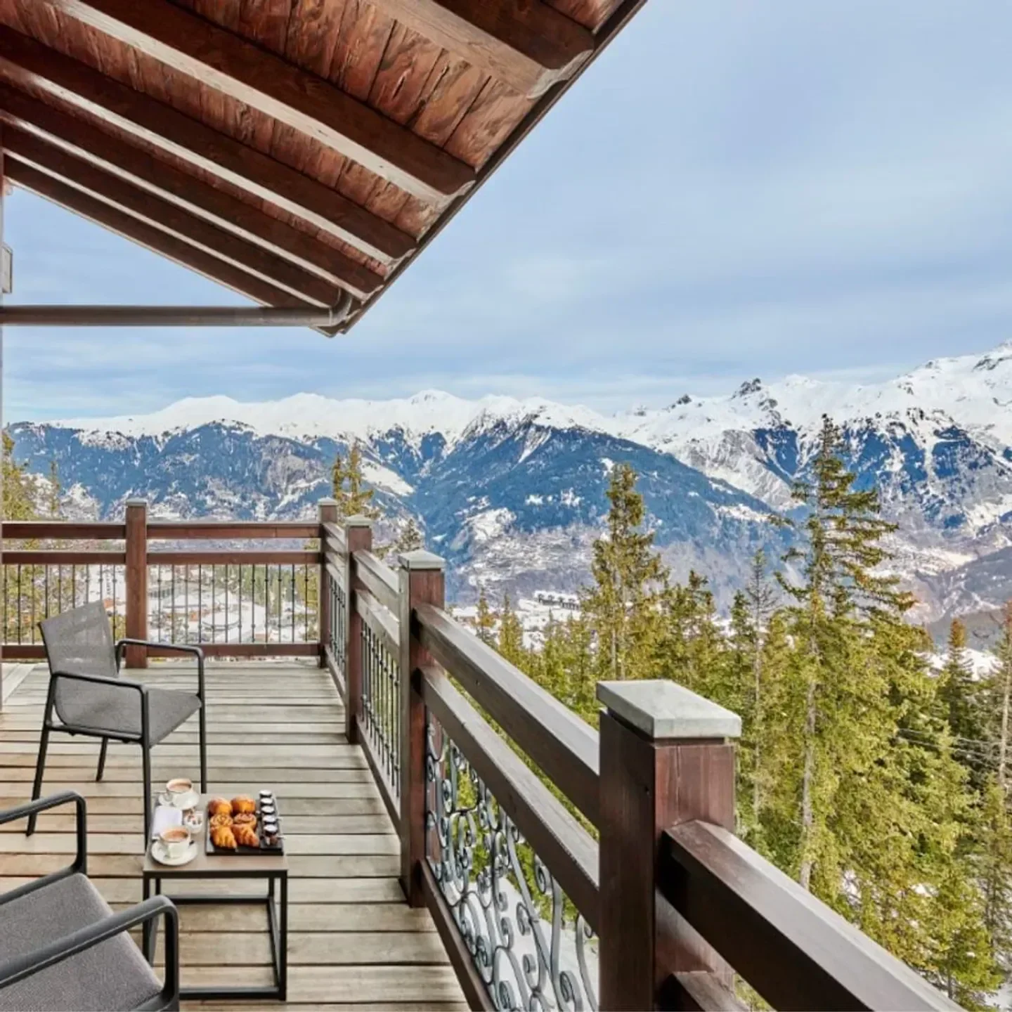 Scenic balcony view at Le Comptoir de l'Apogée in Courchevel with mountains in background
