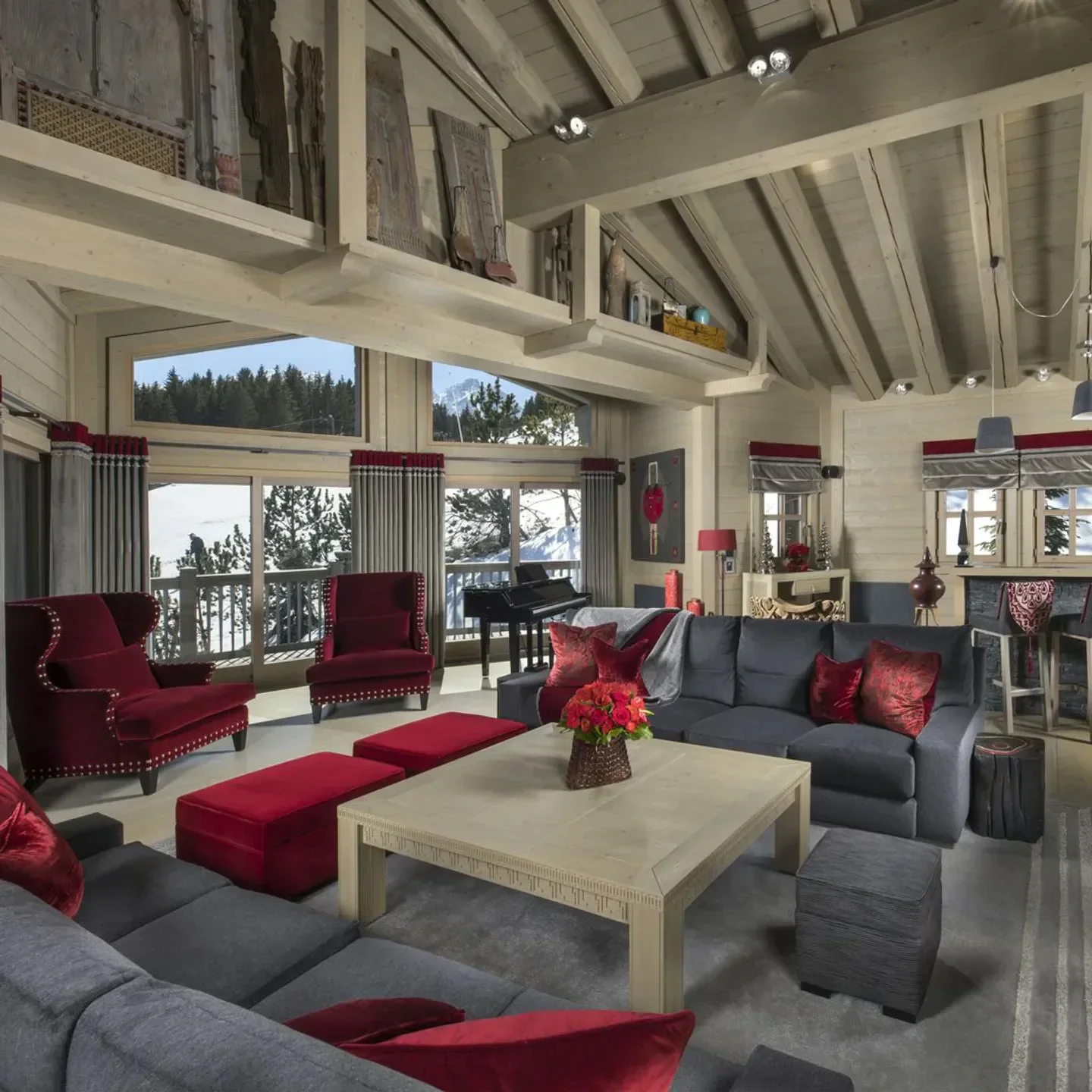 Cozy interior of Le Sarkara restaurant in Courchevel with mountain views and elegant furnishings.